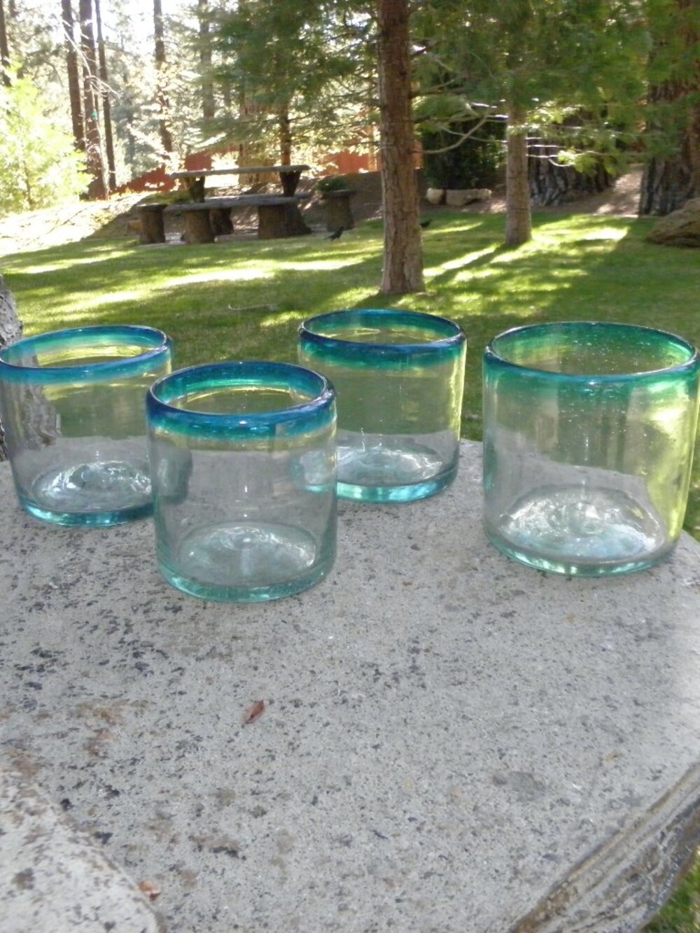 4 Never used Hand blown Mexican juice glasses excellent cond. blue trim